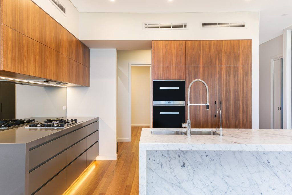 Annandale, Timber Veneer and polyurethane kitchen with a Carrara Marble feature island