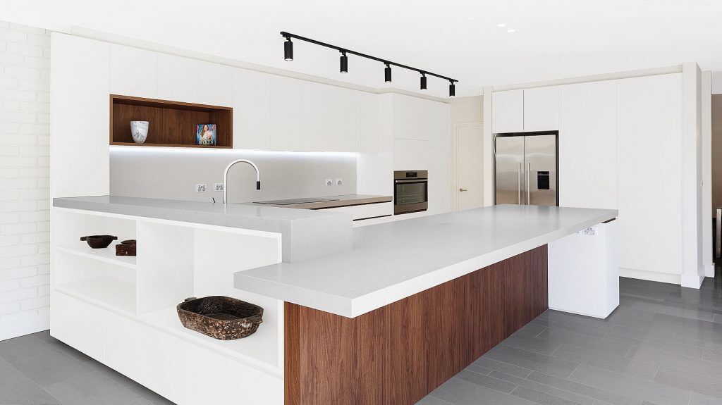 Dover Heights Kitchen, Polyurethane and Likewood Timber Grain kitchen with a sleek concrete Caesarstone bench.
