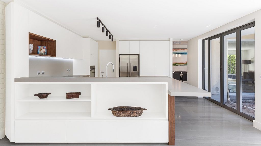 Dover Heights Kitchen, Polyurethane and Likewood Timber Grain kitchen with a sleek concrete Caesarstone bench.