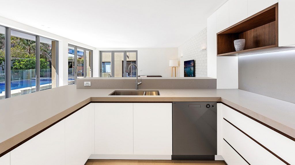 Dover Heights Kitchen, Polyurethane and Likewood Timber Grain kitchen with a sleek concrete Caesarstone bench.
