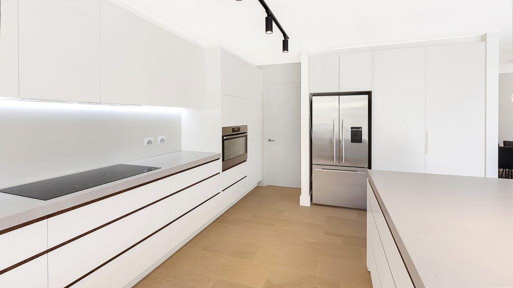 Dover Heights Kitchen, Polyurethane and Likewood Timber Grain kitchen with a sleek concrete Caesarstone bench.