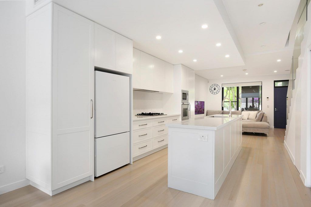 AFTER Lilyfield Renovation, Polyurethane Shaker Style kitchen with an island bench and Michelangelo stone tops
