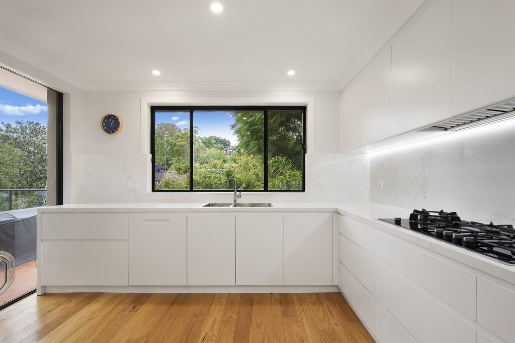 Forestville, Streamline polyurethane kitchen with integrated 45 degree handles