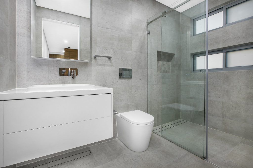 Satin Polyurethane vanity and Caesarstone top with mirror cabinets above - Chipping Norton, Sydney