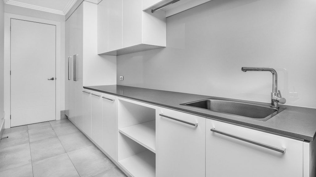 Polyurethane laundry with concrete look Caesarstone bench - Twin Creeks, Sydney