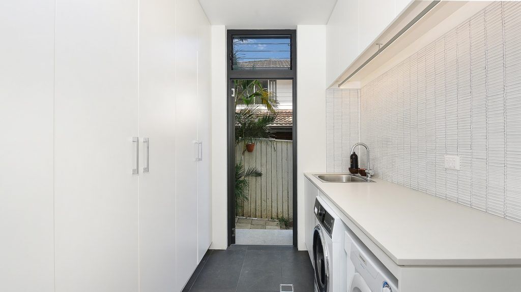 White Laminate laundry with above bench hanging rail - Randwick, Sydney