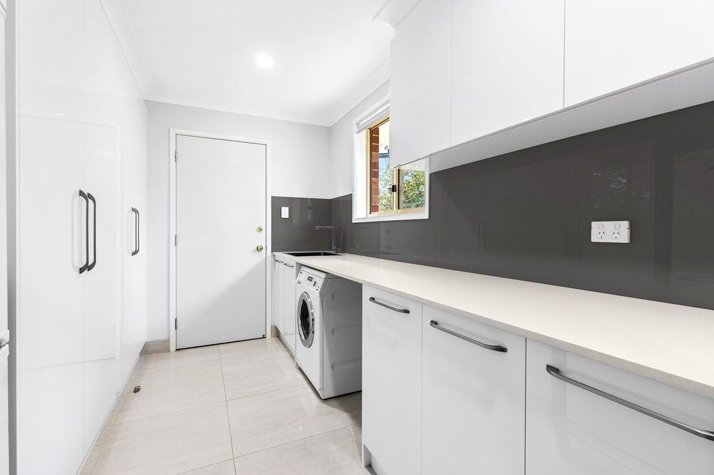 Superior White Ultraglaze laundry with generous bench space - Wattle Grove, Sydney