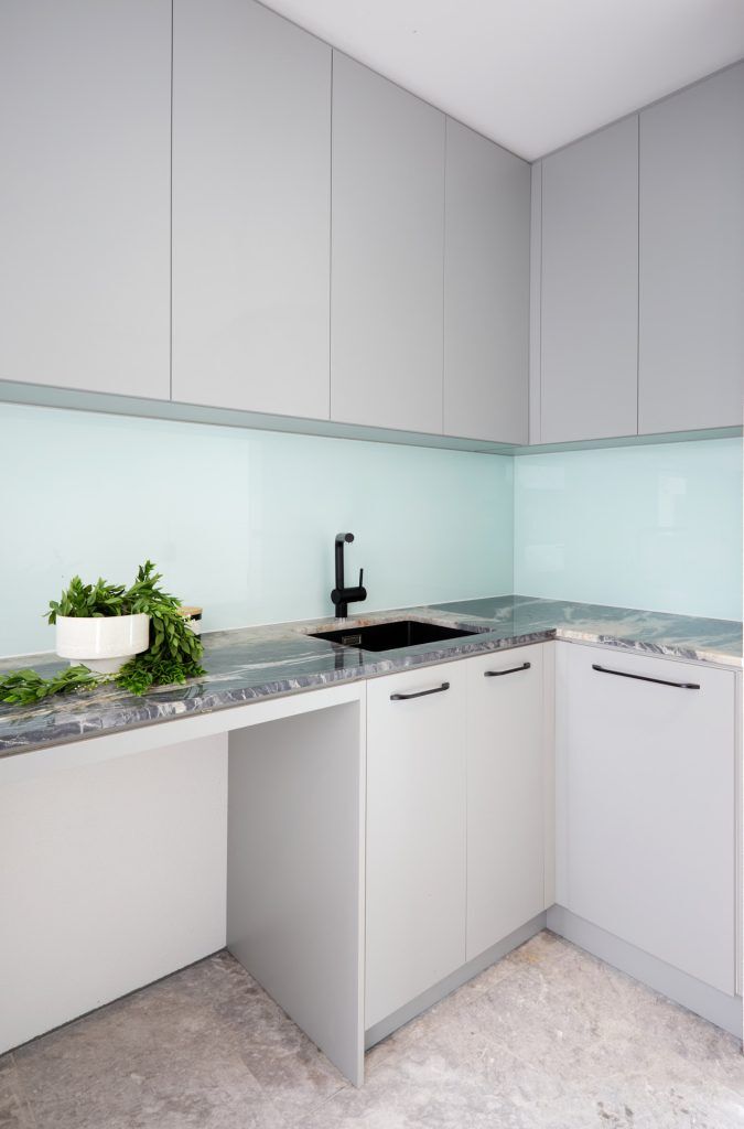 Waterproof Laundry Cabinets with Marble stone top and glass splashback - Strathfield, Sydney