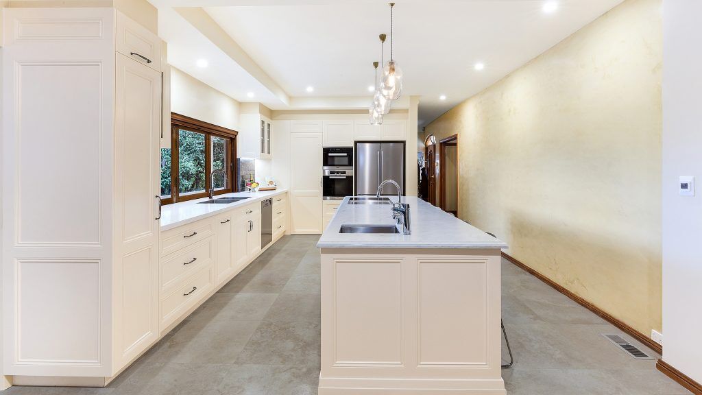 Epping, Provincial Style kitchen in a Satin Polyurethane finish with a Carrara Marble benchtop