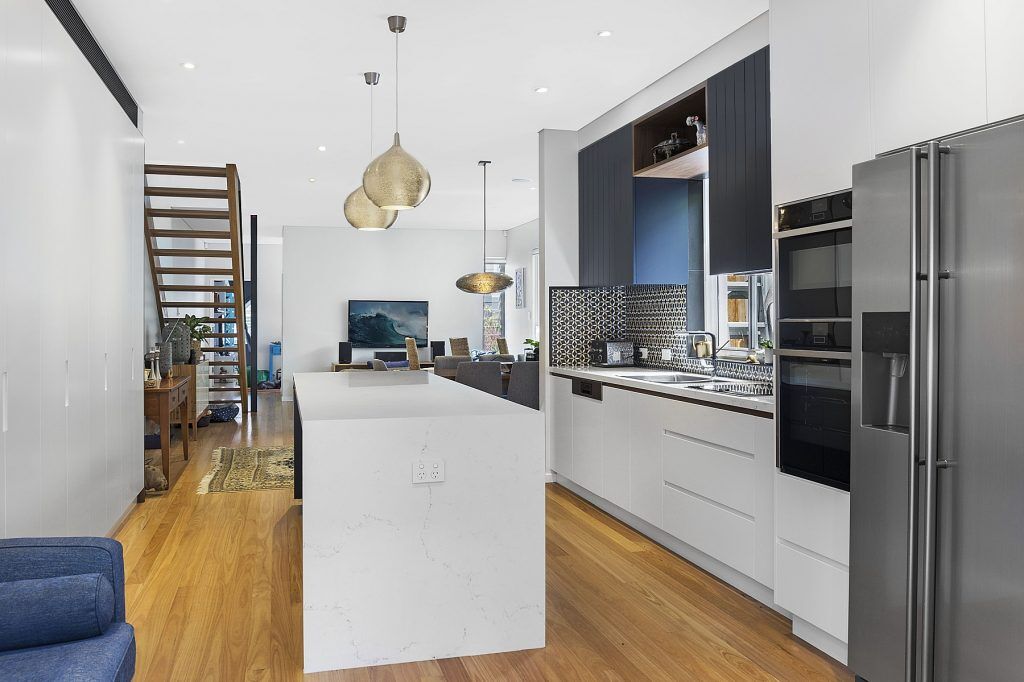 North Bondi, Two-tone Polyurethane kitchen with V-Groove panels and integrated handles