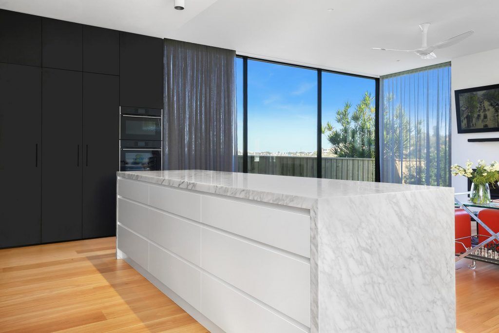 Putney, Veneer / Polyurethane kitchen featuring a Carrara Marble Island bench with waterfall return
