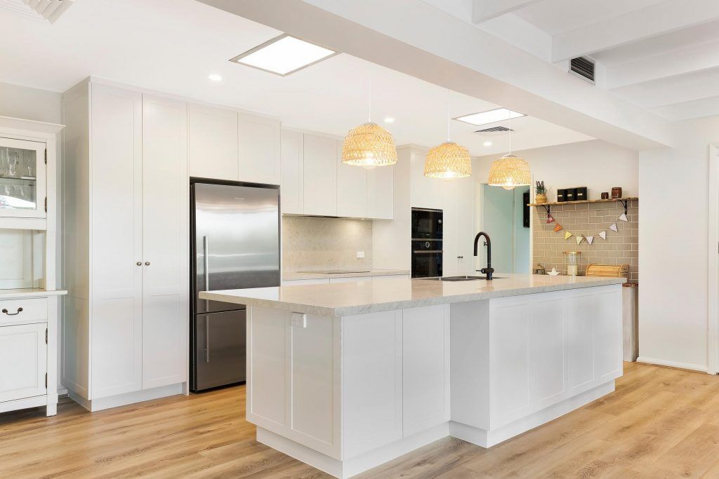 Carlingford, Satin polyurethane kitchen in a shaker design with a stone benchtop and splashback