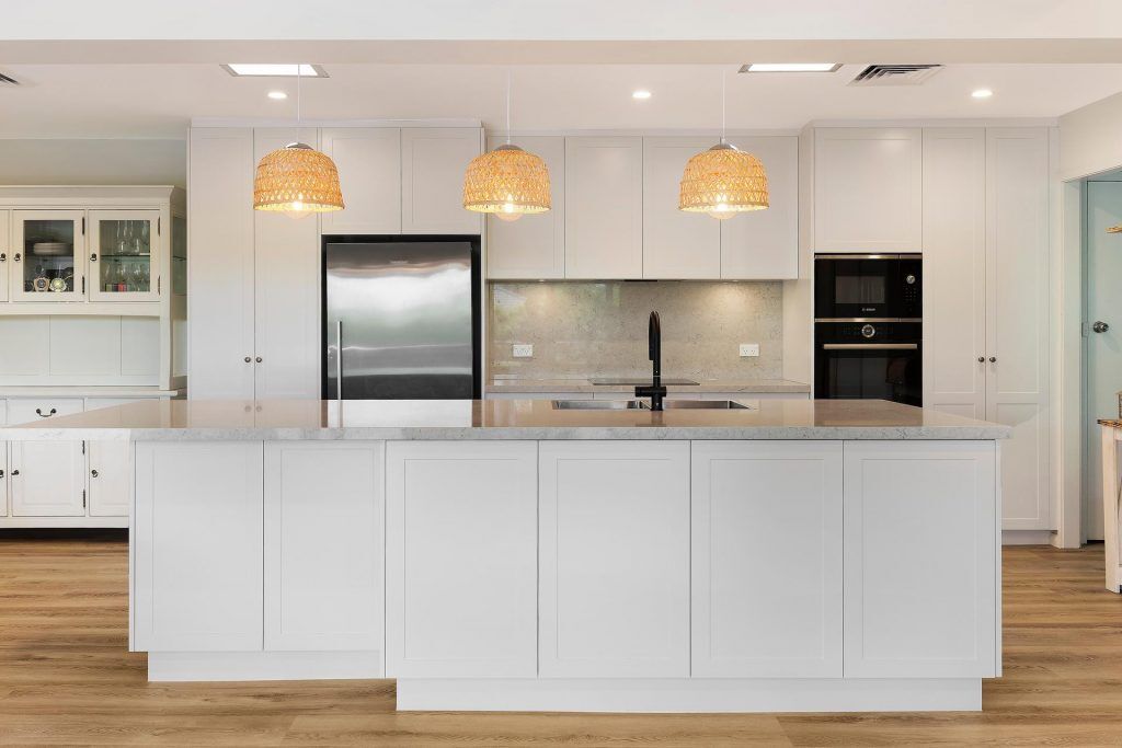 Carlingford, Satin polyurethane kitchen in a shaker design with a stone benchtop and splashback