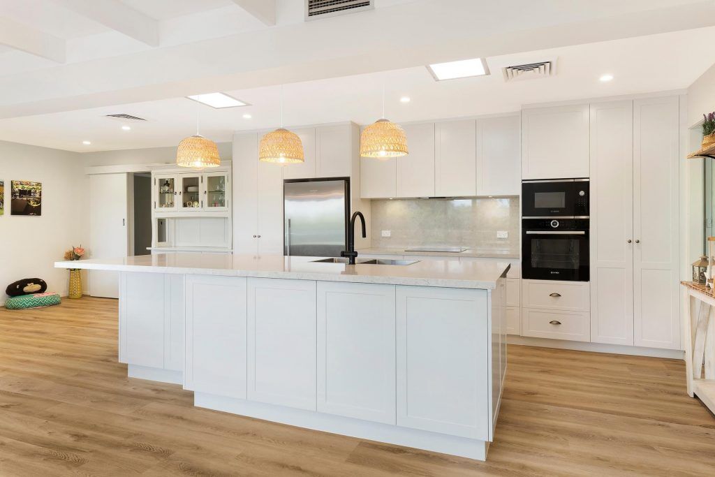 Carlingford, Satin polyurethane kitchen in a shaker design with a stone benchtop and splashback