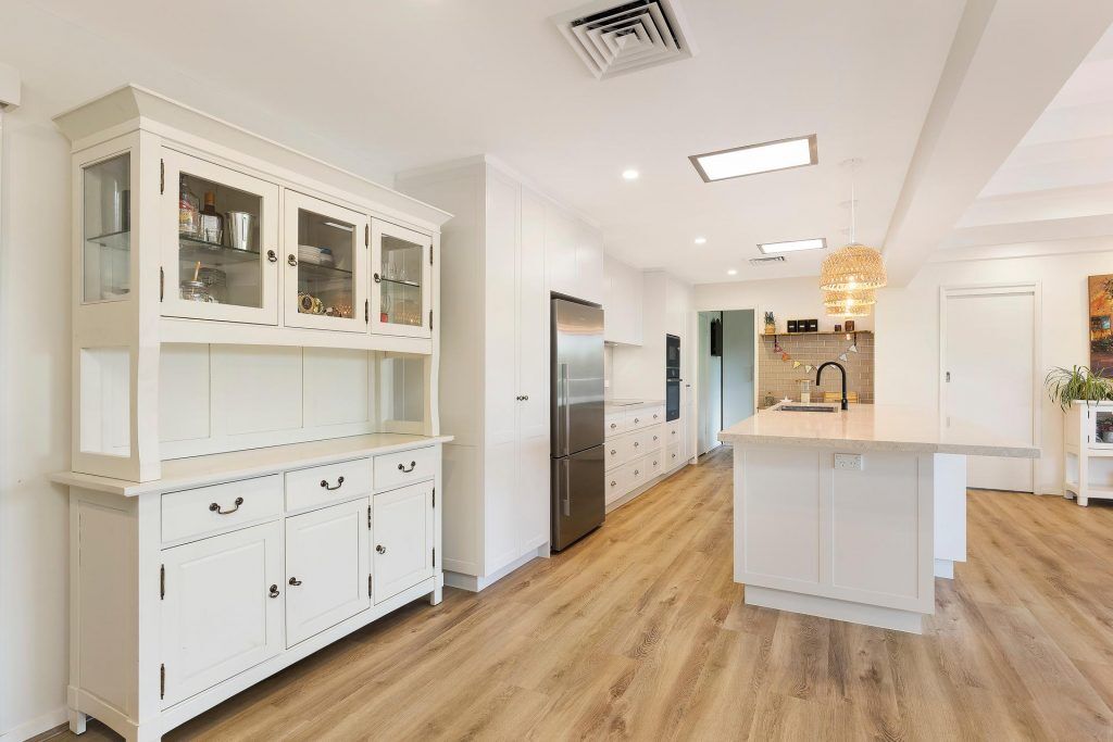 Carlingford, Satin polyurethane kitchen in a shaker design with a stone benchtop and splashback