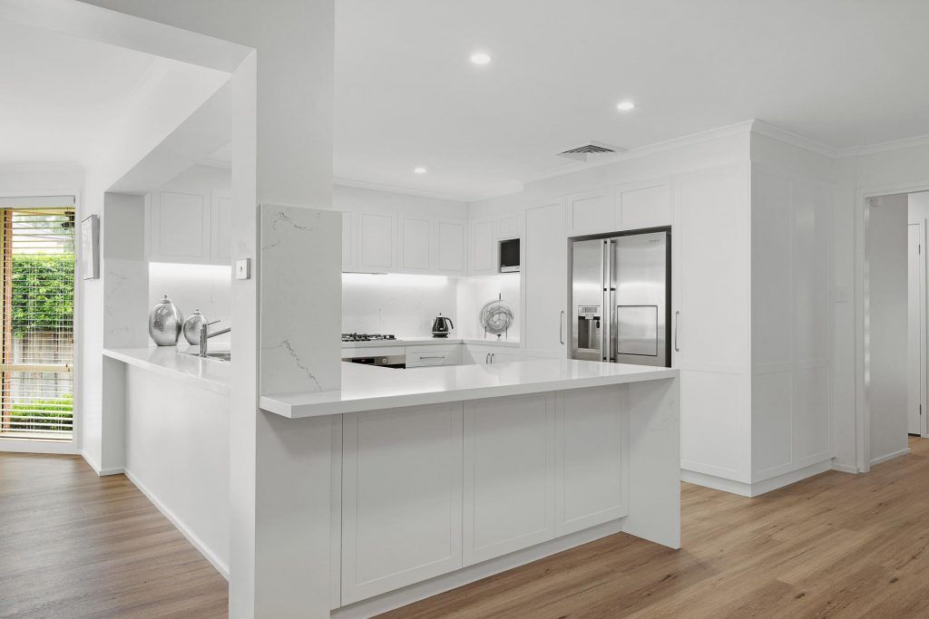 Castle Hill, Polyurethane Shaker style kitchen with stone benchtop and splashback