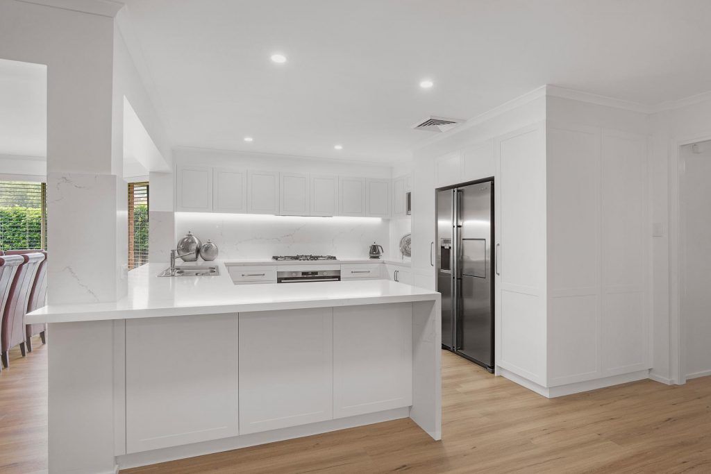 Castle Hill, Polyurethane Shaker style kitchen with stone benchtop and splashback