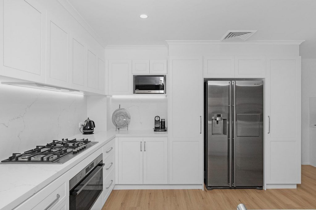 Castle Hill, Polyurethane Shaker style kitchen with stone benchtop and splashback