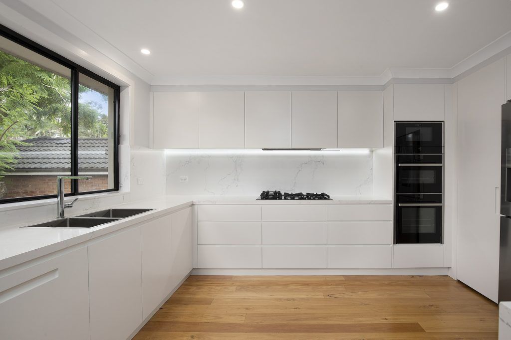 Forestville, Streamline polyurethane kitchen with integrated 45 degree handles