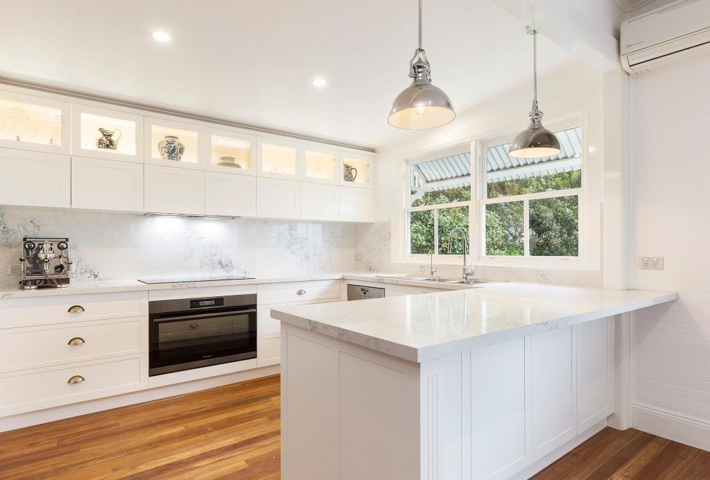 Point Claire, Satin Polyurethane Shaker style kitchen with a Monte Bianco Quantum Quartz benchtop and splashback