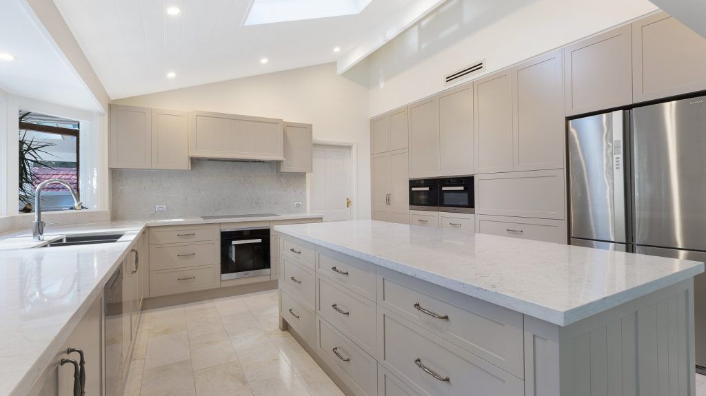 Wahroonga Sydney, Satin Polyurethane Shaker Style kitchen with V-Groove feature panels and a Caesarstone benchtop