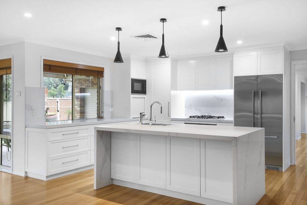 Wattle Grove, Satin Polyurethane Shaker Style kitchen, Statuario Maximus Caesarstone splashback and island bench with waterfall return