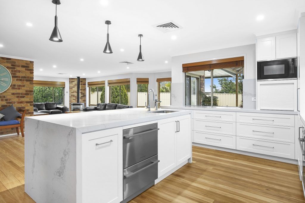 Wattle Grove, Satin Polyurethane Shaker Style kitchen, Statuario Maximus Caesarstone splashback and island bench with waterfall return