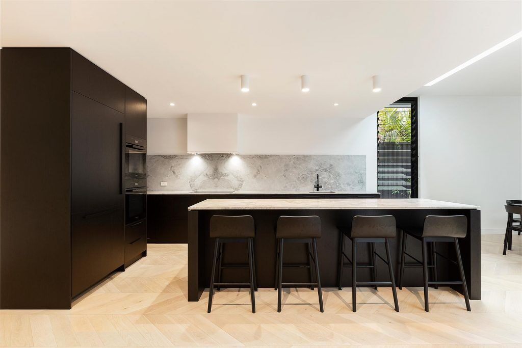 Veneer kitchen featuring a Super White Stone island bench and splashback - Concord, Sydney