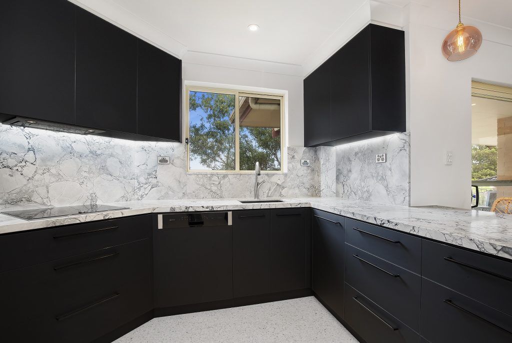 Miranda, Venette kitchen in Polytec Black with a 40mm Super White stone benchtop and splashback