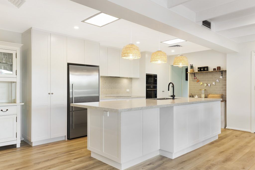 AFTER Carlingford Renovation - Satin polyurethane kitchen in a shaker design with a stone benchtop and splashback