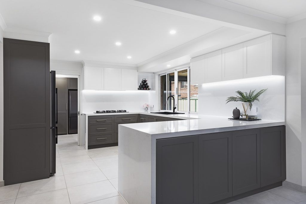 Chipping Norton, Shaker polyurethane kitchen with a Quantum Quartz Michelangelo benchtop, splashback and waterfall return breakfast bar