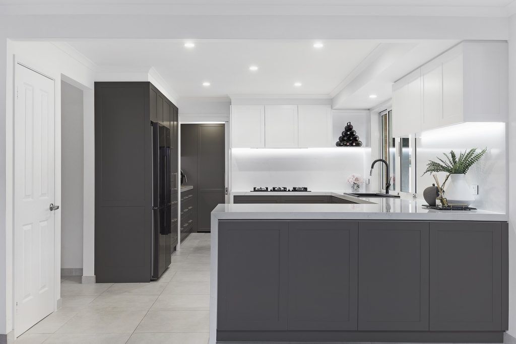 Chipping Norton, Shaker polyurethane kitchen with a Quantum Quartz Michelangelo benchtop, splashback and waterfall return breakfast bar