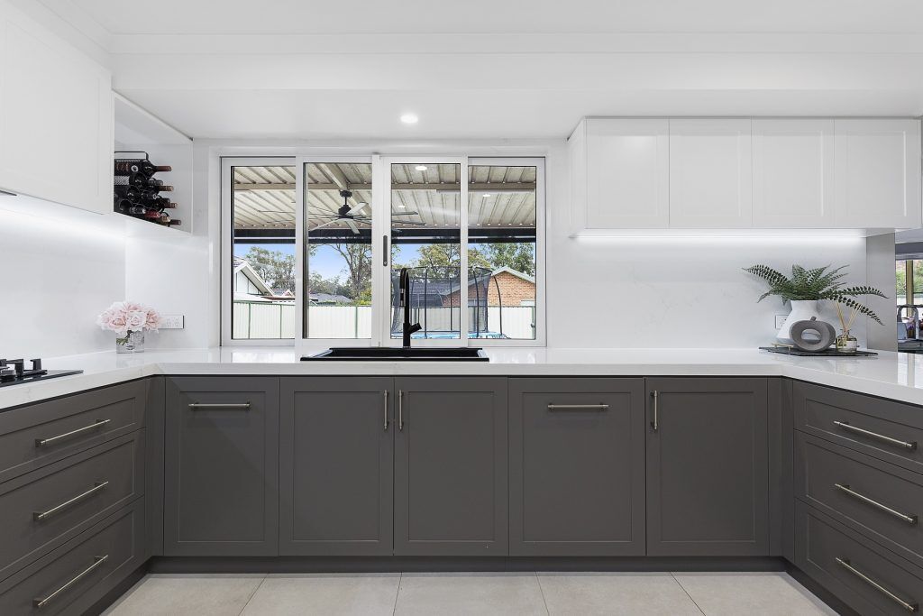 Chipping Norton, Shaker polyurethane kitchen with a Quantum Quartz Michelangelo benchtop, splashback and waterfall return breakfast bar
