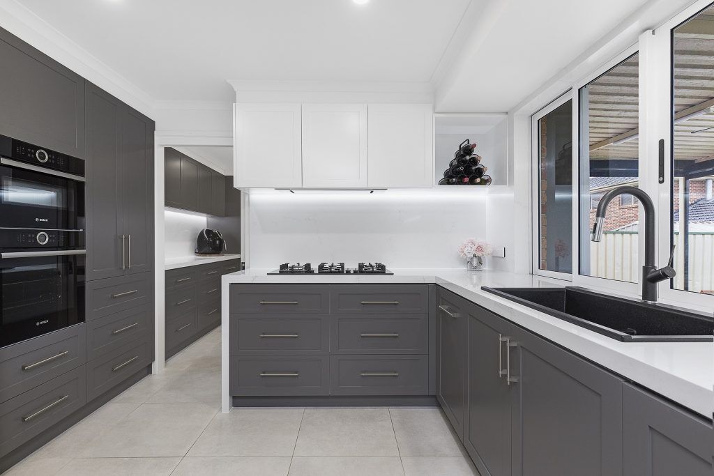 Chipping Norton, Shaker polyurethane kitchen with a Quantum Quartz Michelangelo benchtop, splashback and waterfall return breakfast bar