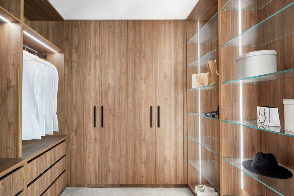 Laminate Walk-in Wardrobe in Nataio Walnut Woodmatt with LED lighting and glass shelving - Strathfield, Sydney