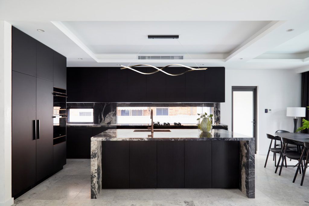 Fenix and Polyurethane Kitchen featuring an island bench with Marble stone tops and splashback - Strathfield, Sydney