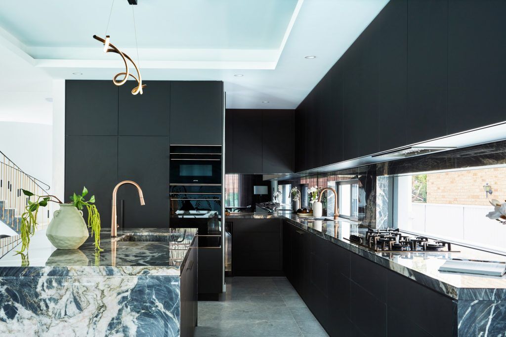 Fenix and Polyurethane Kitchen featuring an island bench with Marble stone tops and splashback - Strathfield, Sydney