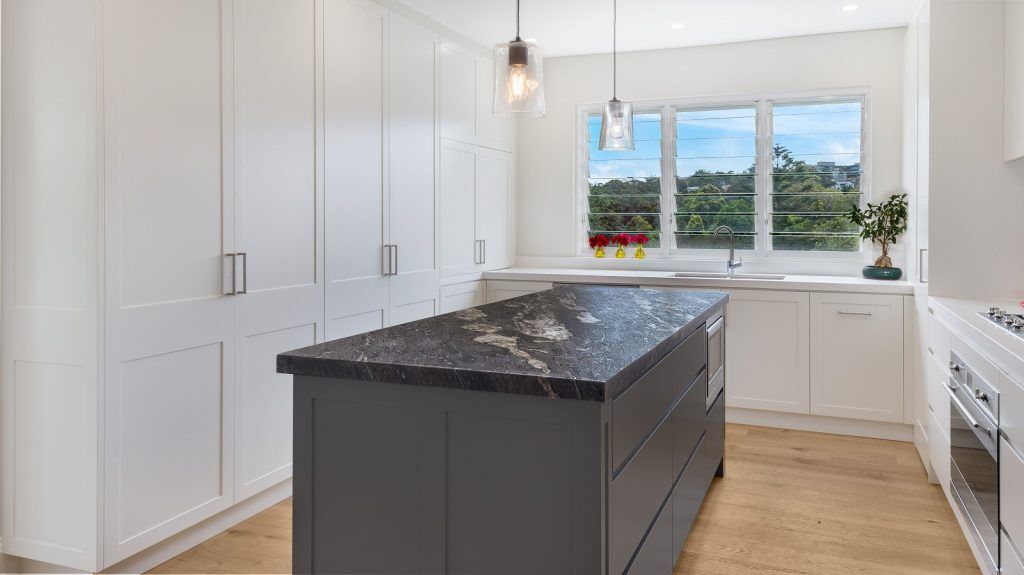 Greenwich, Shaker Style kitchen in a polyurethane finish with a Cosmic Black Granite benchtop