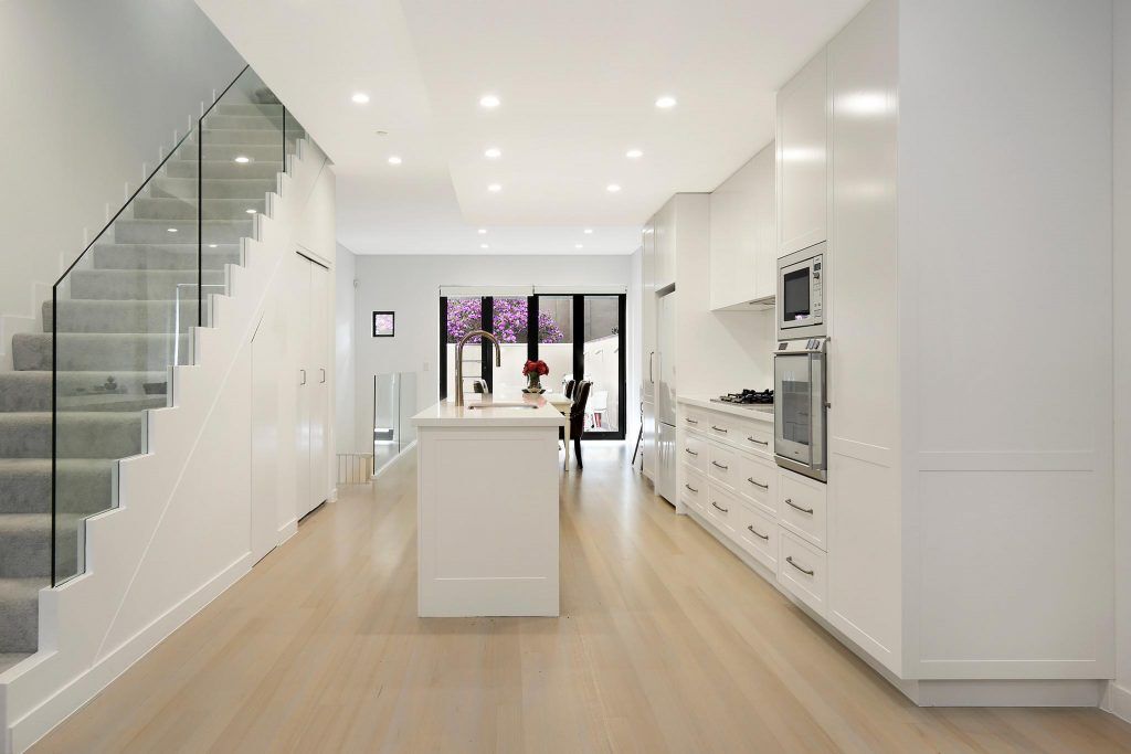AFTER Lilyfield Renovation, Polyurethane Shaker Style kitchen with an island bench and Michelangelo stone tops