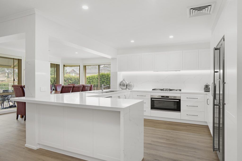 AFTER Castle Hill Renovation, Polyurethane Shaker style kitchen with stone benchtop and splashback