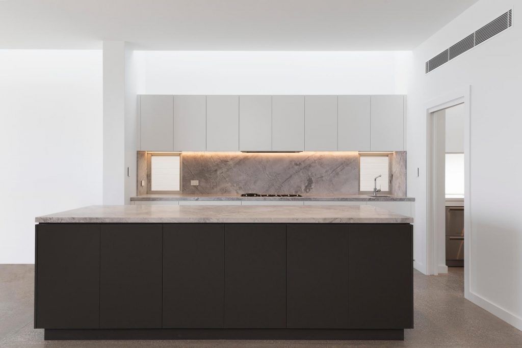 Satin Polyurethane kitchen with electronic push open drawers and a stone benchtop and splashback - Freshwater, Sydney