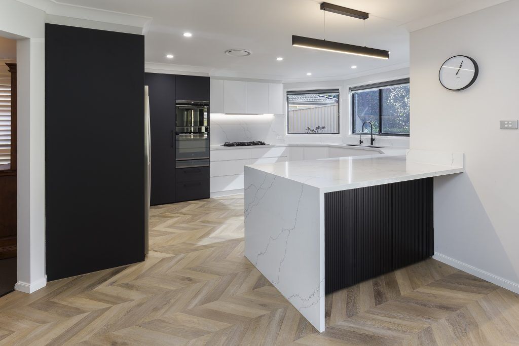 AFTER Holsworthy Renovation, Polyurethane Venette Kitchen with a Quantum Quartz Venatino Statuario breakfast bar, benchtops and splashback