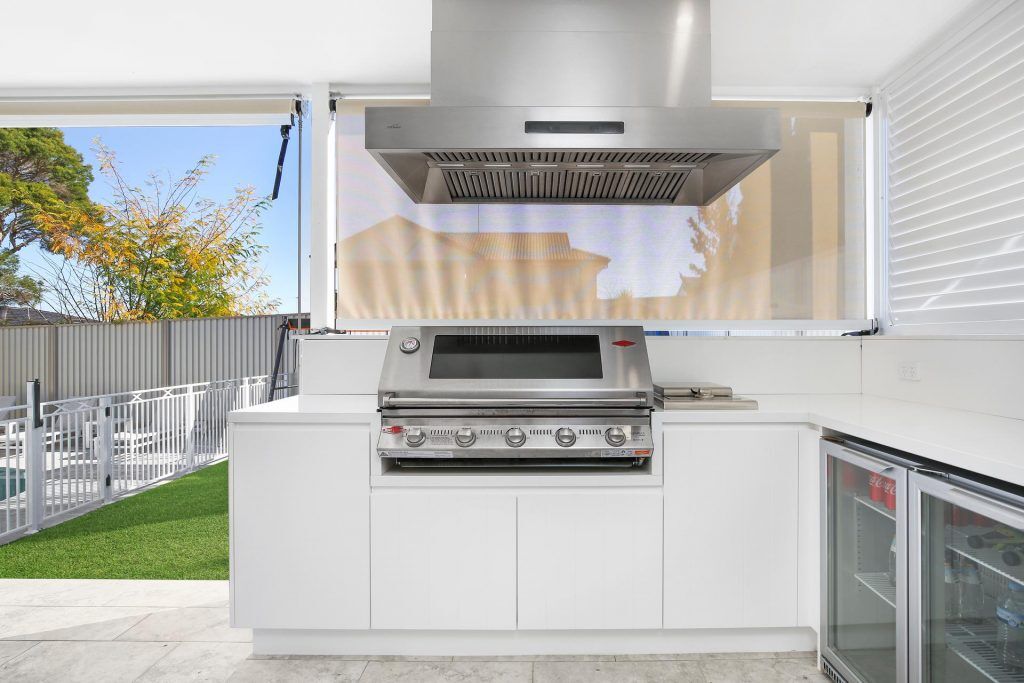 Polyurethane Outdoor BBQ area with V-groove doors and Caesarstone bench - Georges Hall, Sydney