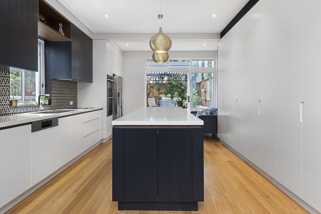 AFTER North Bondi Renovation, Two-tone Polyurethane kitchen with V-Groove panels and integrated handles