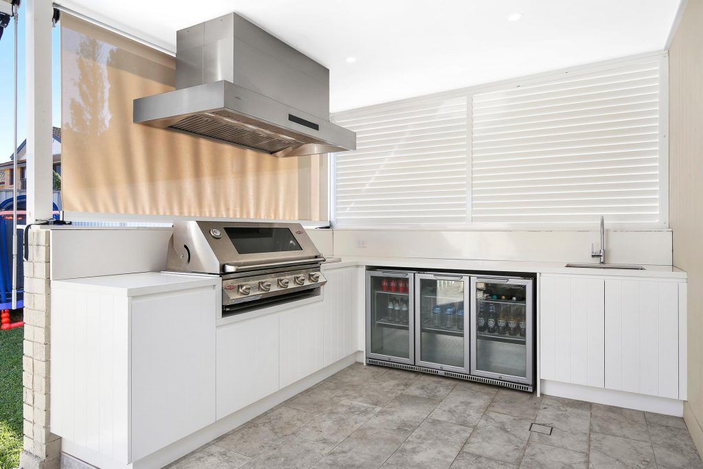 Polyurethane Outdoor BBQ area with V-groove doors and Caesarstone bench - Georges Hall, Sydney