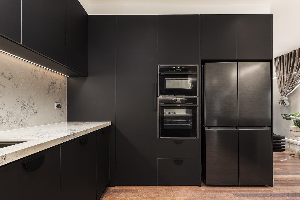 Casula, Matt Black cabinets with Quantum Quartz stone island bench, benchtops and splashback in Monte Bianco