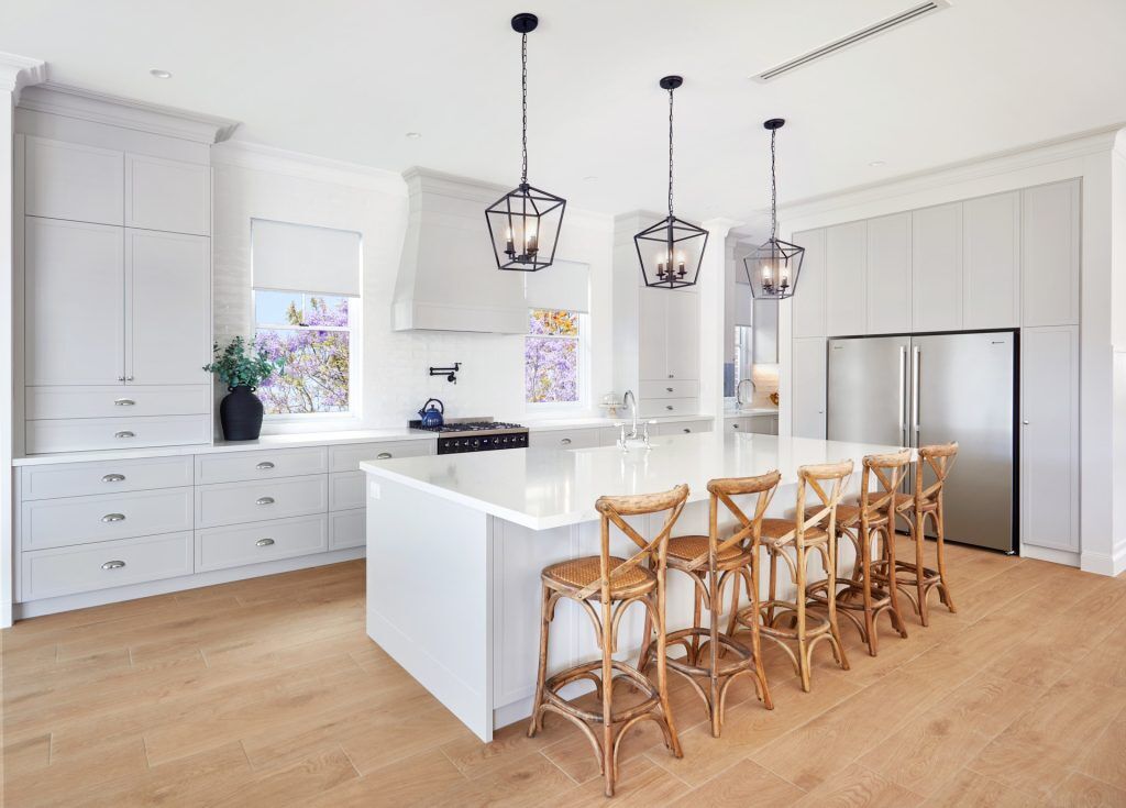 Belmore, Satin Polyurethane Shaker style kitchen with a stone benchtop and splashback