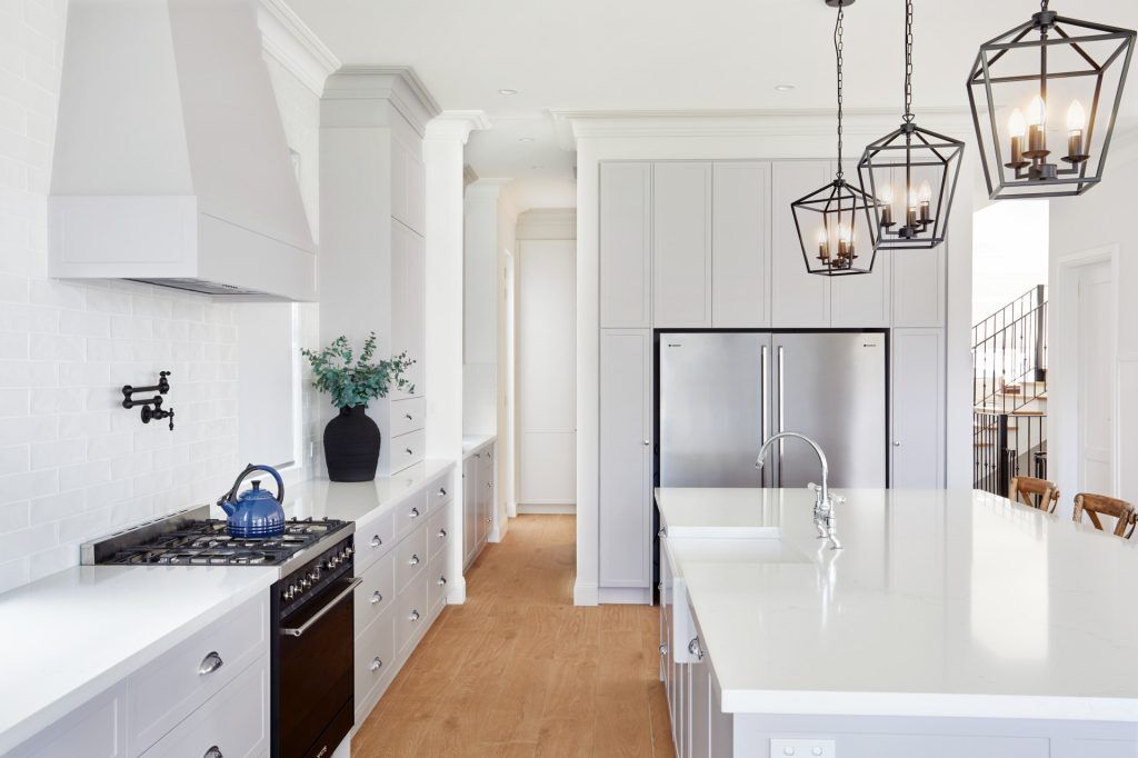 Belmore, Satin Polyurethane Shaker style kitchen with a stone benchtop and splashback