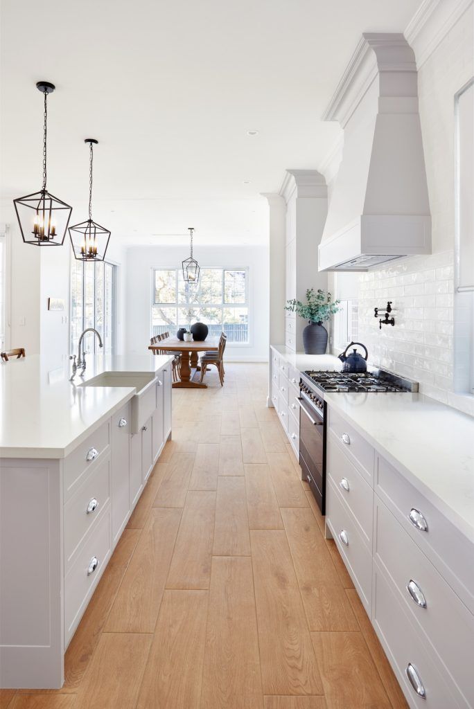 Belmore, Satin Polyurethane Shaker style kitchen with a stone benchtop and splashback